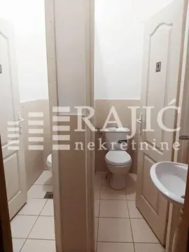 View of the restroom with tiles and sanitary fixtures. - image 6
