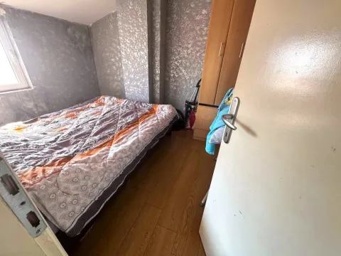 Small bedroom with a double bed and a wardrobe. - image 6