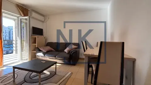 Living room with sofa, coffee table and dining area. - image 3