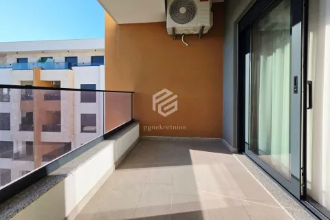 Unfurnished balcony with glass railing and a view of neighboring buildings. - image 4