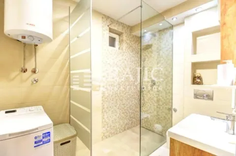 Modernly equipped bathroom with a walk-in shower. - image 13