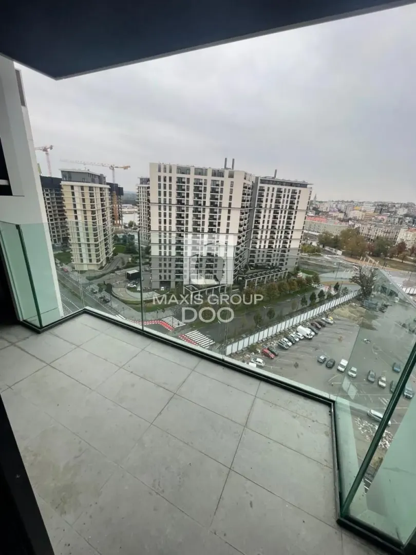 View from the balcony overlooking surrounding buildings and cityscape.
