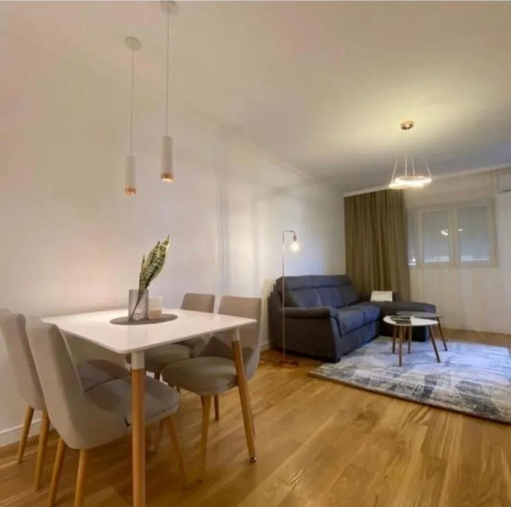 Living room with dining area and modern furniture.