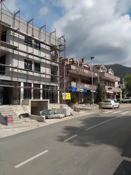Street view of a building under construction with scaffolding. - image 3