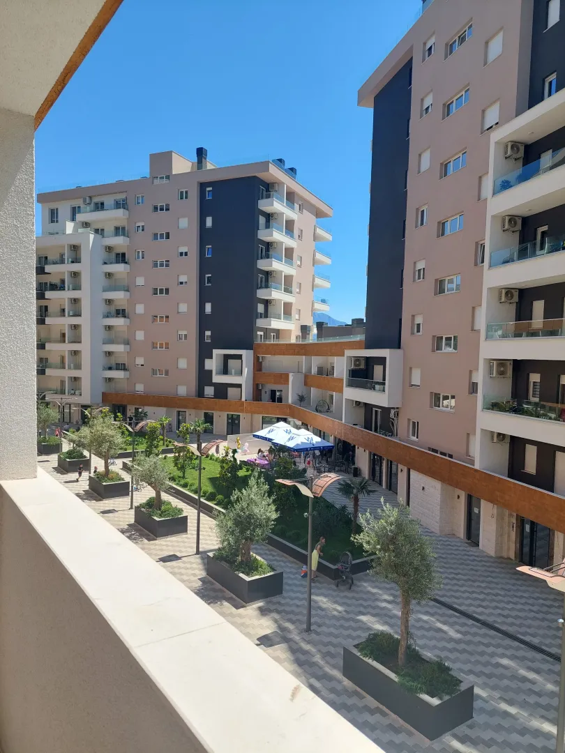 View from the terrace overlooking the courtyard and surrounding residential buildings.