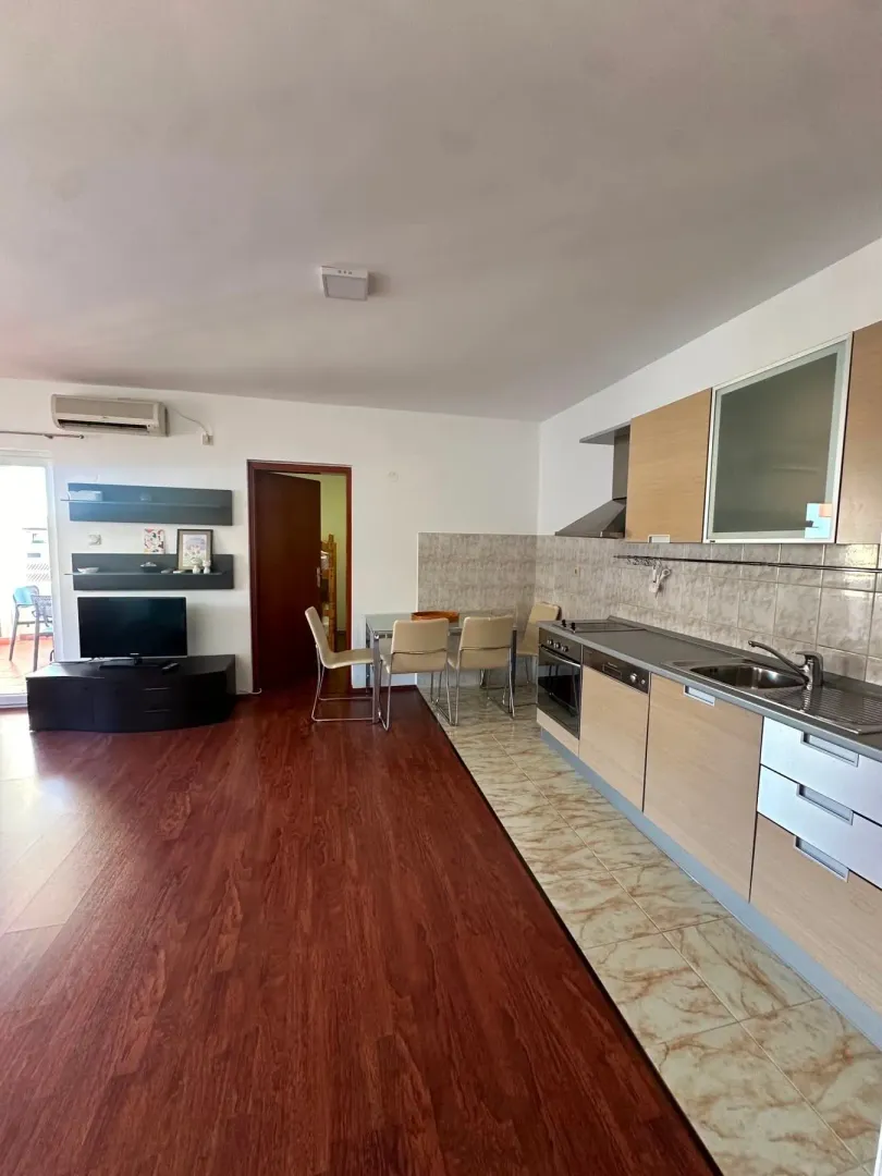 Spacious living room with an integrated kitchen and dining area.