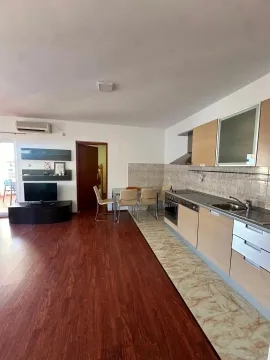 Spacious living room with an integrated kitchen and dining area. - image 2