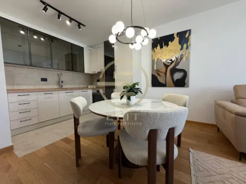 Modern kitchen with dining area and contemporary lighting. - image 6