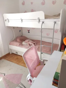 Children's room with a bunk bed and a desk. - image 11