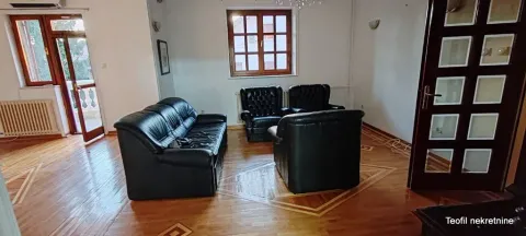 Living room with seating furniture and parquet flooring. - image 5