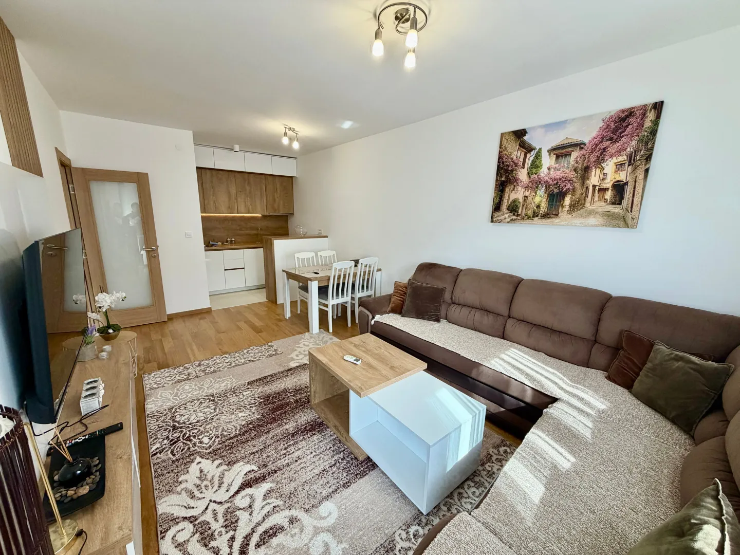 Spacious living room connected to the dining area and kitchen.