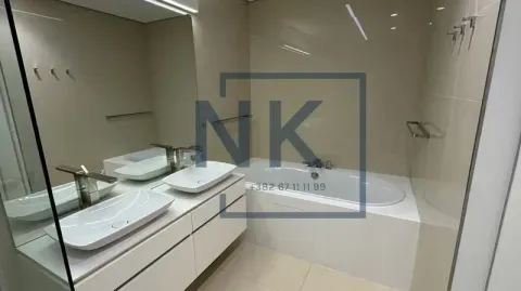 Modern bathroom with double sink and bathtub. - image 13