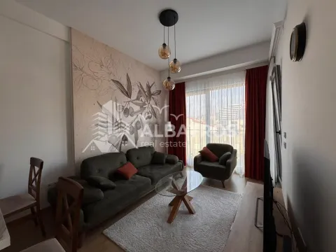 Living room with a sofa set, armchair, and access to the terrace. - image 3
