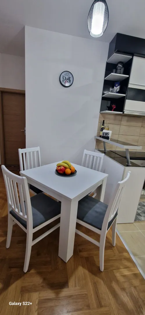 Dining table with chairs as part of the kitchen.