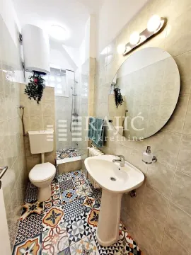 Small bathroom with a sink, toilet, and walk-in shower. - image 18