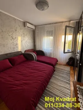 Furnished bedroom with two beds and access to the terrace. - image 10
