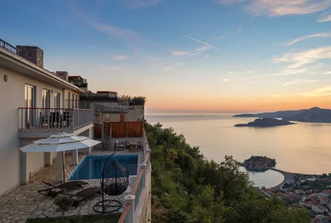 Terrace with a swimming pool and sea view at the villa. - image 4