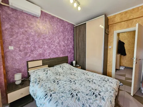 Furnished bedroom with a double bed, wardrobe, and nightstands. - image 9