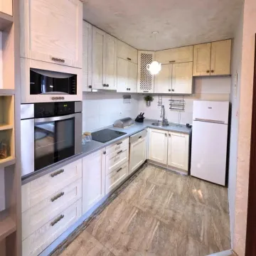 Small kitchen with built-in cabinetry and appliances. - image 3