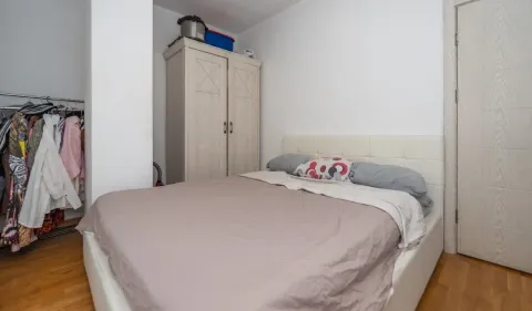 Bedroom with a double bed, wardrobe, and open closet. - image 7