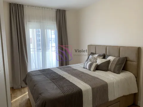 Furnished bedroom with a double bed and a window with curtains. - image 3