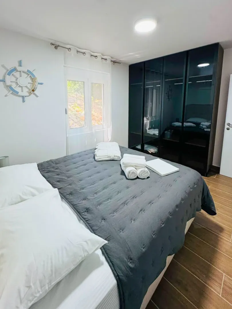 Bedroom with a double bed and a fitted wardrobe.