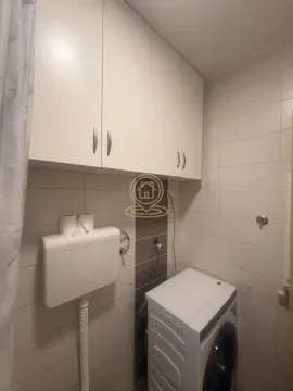 Bathroom equipped with sanitary ware and a washing machine. - image 7