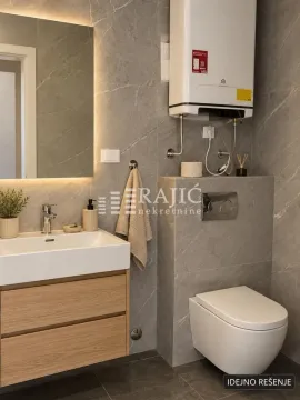 Moderno kupatilo sa umivaonikom, WC šoljom i pločicama u sivoj boji. - image 5