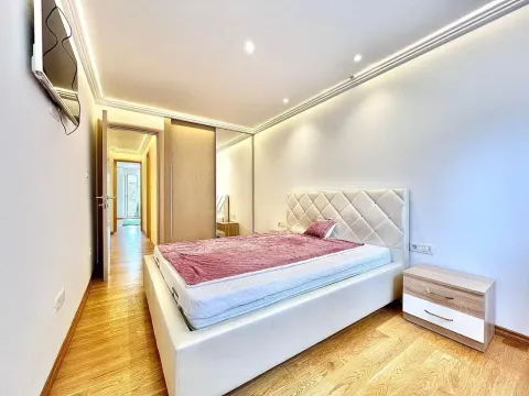 Bright bedroom featuring a double bed and a built-in wardrobe. - image 4