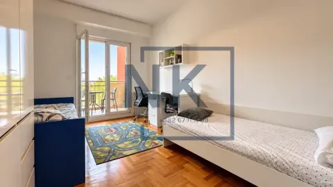 Children's bedroom with two single beds, a desk, and access to the terrace. - image 9
