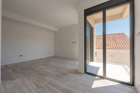 Empty room with ceramic tiled floor and access to the terrace. - image 5