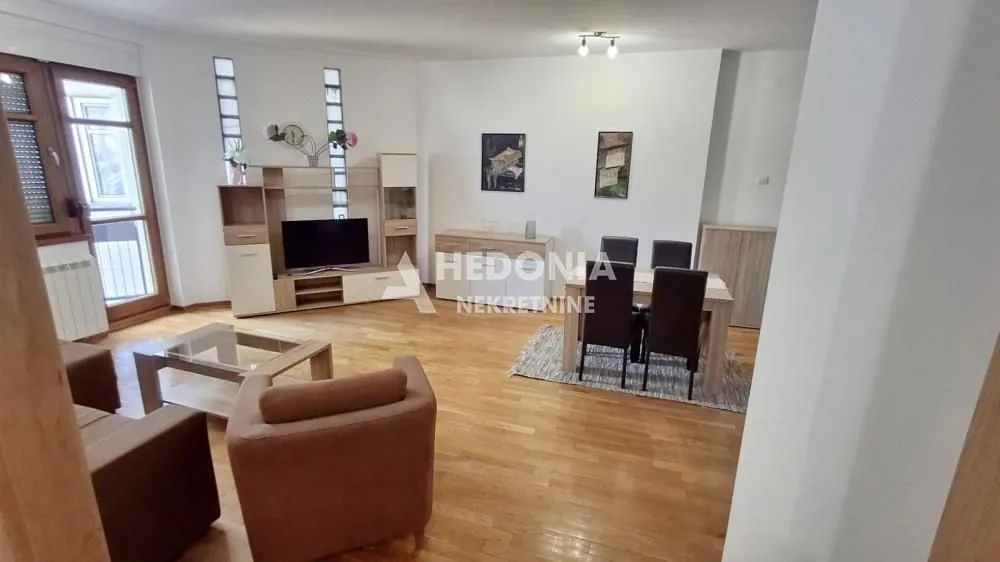 Spacious living room with a dining area and seating set.
