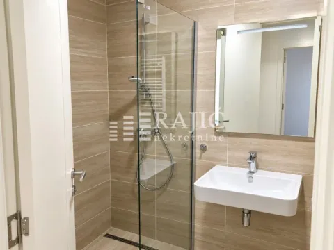 Modern bathroom with a walk-in shower and a washbasin. - image 7