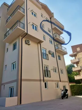 Exterior view of a residential building with balconies. - image 6