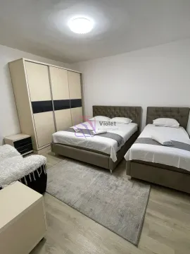 Bedroom with a double bed, a single bed, and a wardrobe. - image 8