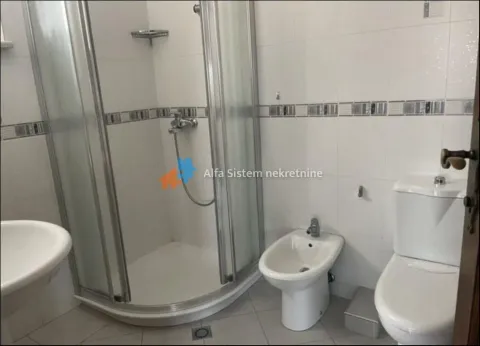 Bathroom equipped with a shower cabin, washbasin, bidet, and toilet. - image 11