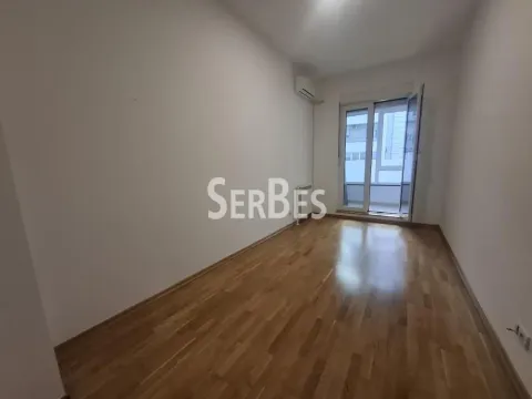 Empty unfurnished room with wooden flooring and access to the terrace. - image 14