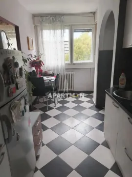 Small kitchen with a dining table by the window. - image 17