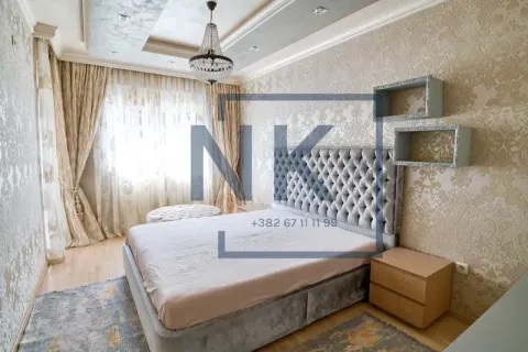 Furnished bedroom with a double bed, bedside tables, and curtains. - image 7
