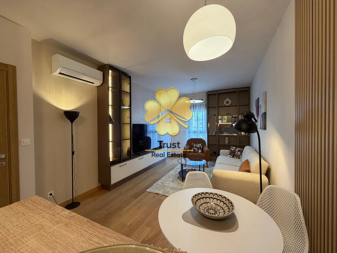 Modern and bright living room with a dining area.