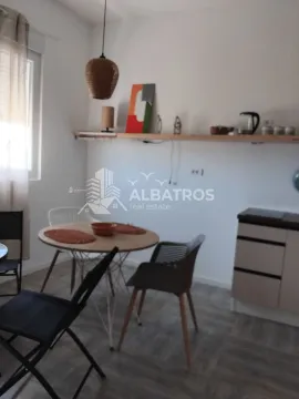 Small kitchen with a dining table and chairs. - image 2