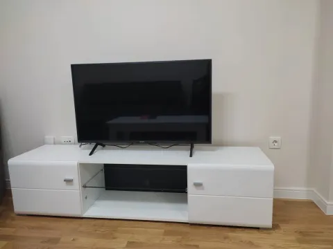 White TV stand in the living room. - image 6