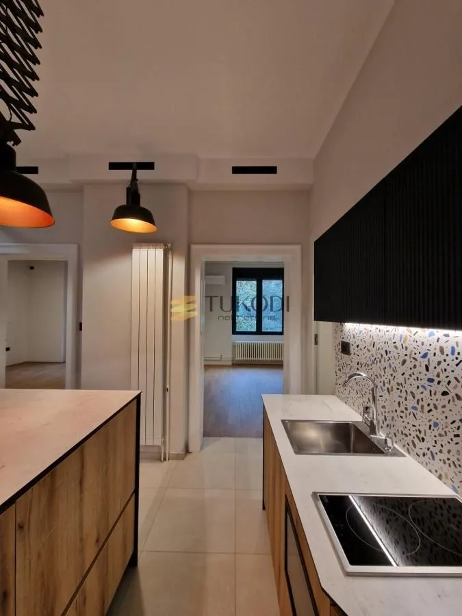 View of a modern kitchen equipped with a built-in stovetop and sink.
