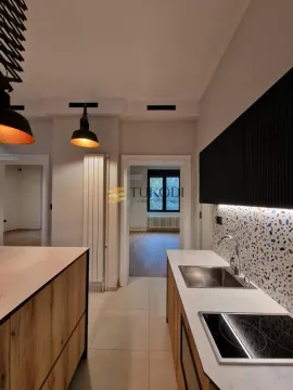 View of a modern kitchen equipped with a built-in stovetop and sink. - image 19