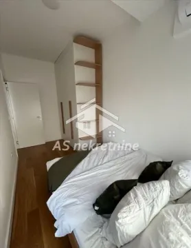 Bedroom with a double bed and a fitted wardrobe. - image 10