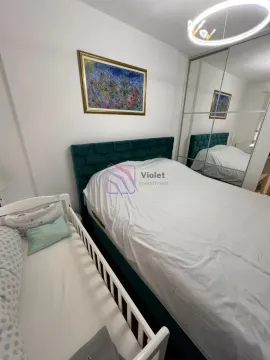 Bedroom with a double bed and a baby crib. - image 12