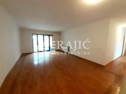 Empty living room with hardwood floors and access to the terrace. - image 2