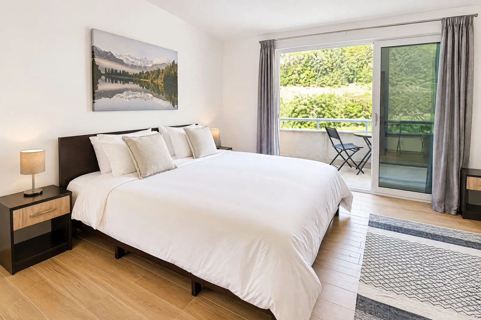 Spacious bedroom with a large double bed and access to the terrace.