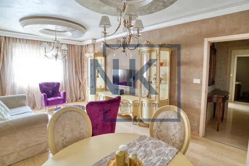 Living room with a dining area and classic furniture.