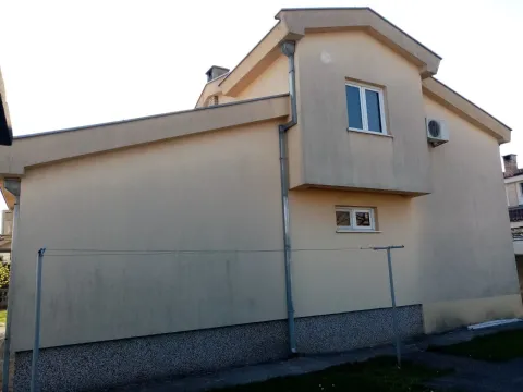 Exterior view of a two-story house with a beige facade. - image 4